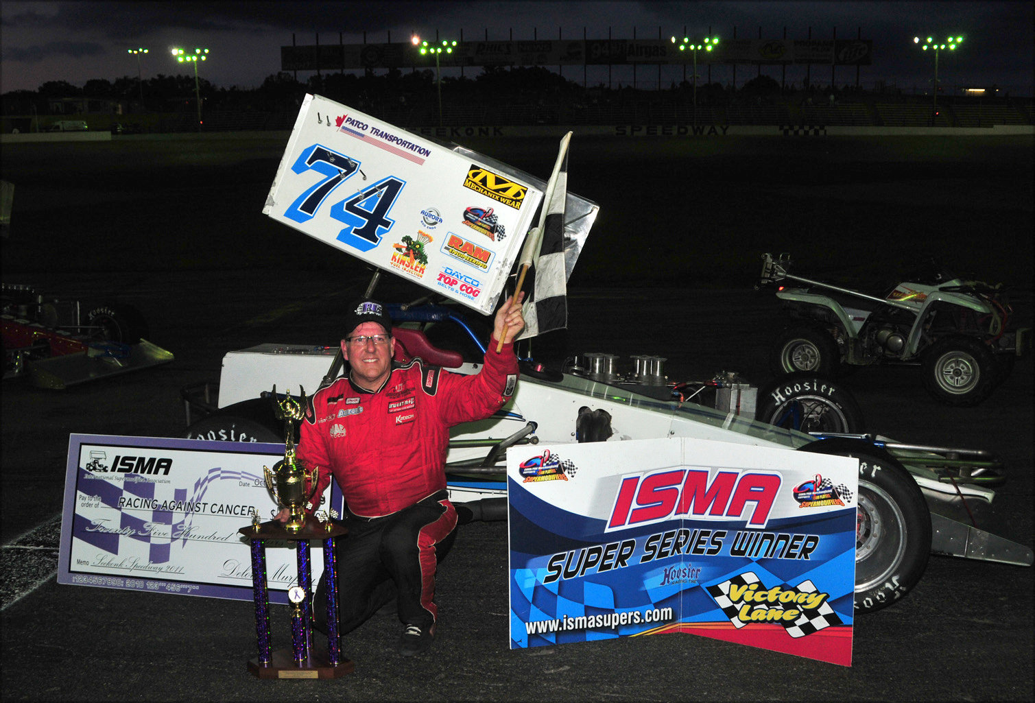 Johnny Benson Jr is all smiles after winning the Seekonk Racing Against Cancer 100, for the second year in a row. - Photo By Jim Feeney